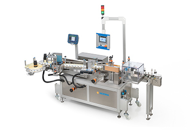HERMA demonstrates with the new compact 152E wrap-around labelling system how a wide range of labels can be handled with a standard system