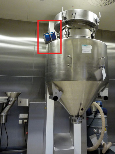 Figure 2: Mobile battery operated NIR instrument attached to a production-scale blending container; the device transmits the NIR data wirelessly to a computer or directly to the ERP system, which evaluates the information in real-time