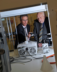 Dr Simon Hirst, chief executive of Sygnature Discovery, shows Dr Stewart Adams OBE some technology in the new laboratories